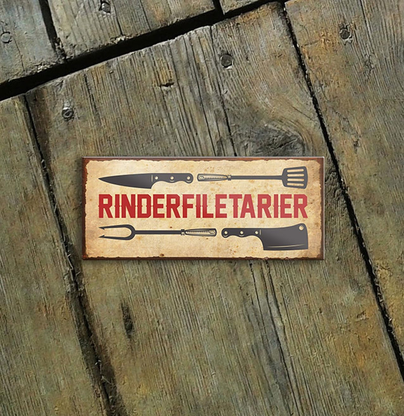 Humorvoller Kühlschrankmagnet mit Grillsymbolen und der Aufschrift "Rinderfiletarier" - ein passendes Geschenk für Grillliebhaber von Schilderkreis24.